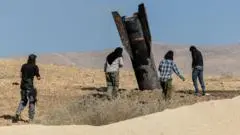 Iran says it has halted attacks on Israel after first exchange of fire since truce