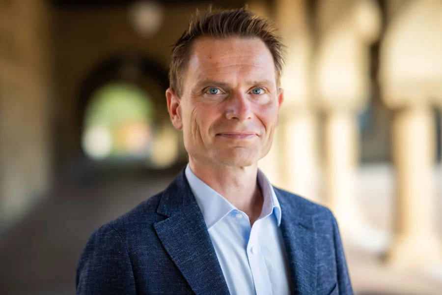 Hybrid‑work expert Nicholas Bloom says World Cup chaos and pricey commutes are turning July into the summer of remote work