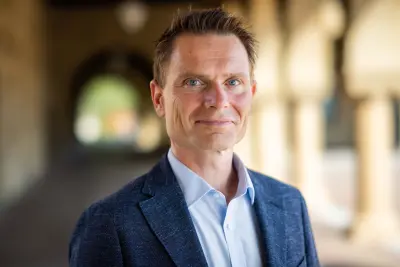 Hybrid‑work expert Nicholas Bloom says World Cup chaos and pricey commutes are turning July into the summer of remote work